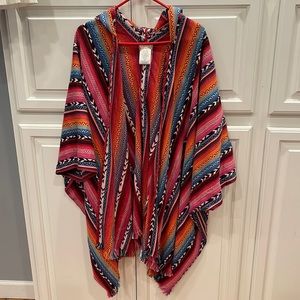 Free People hooded poncho. Vibrant colors. Fringed edges. Long length.